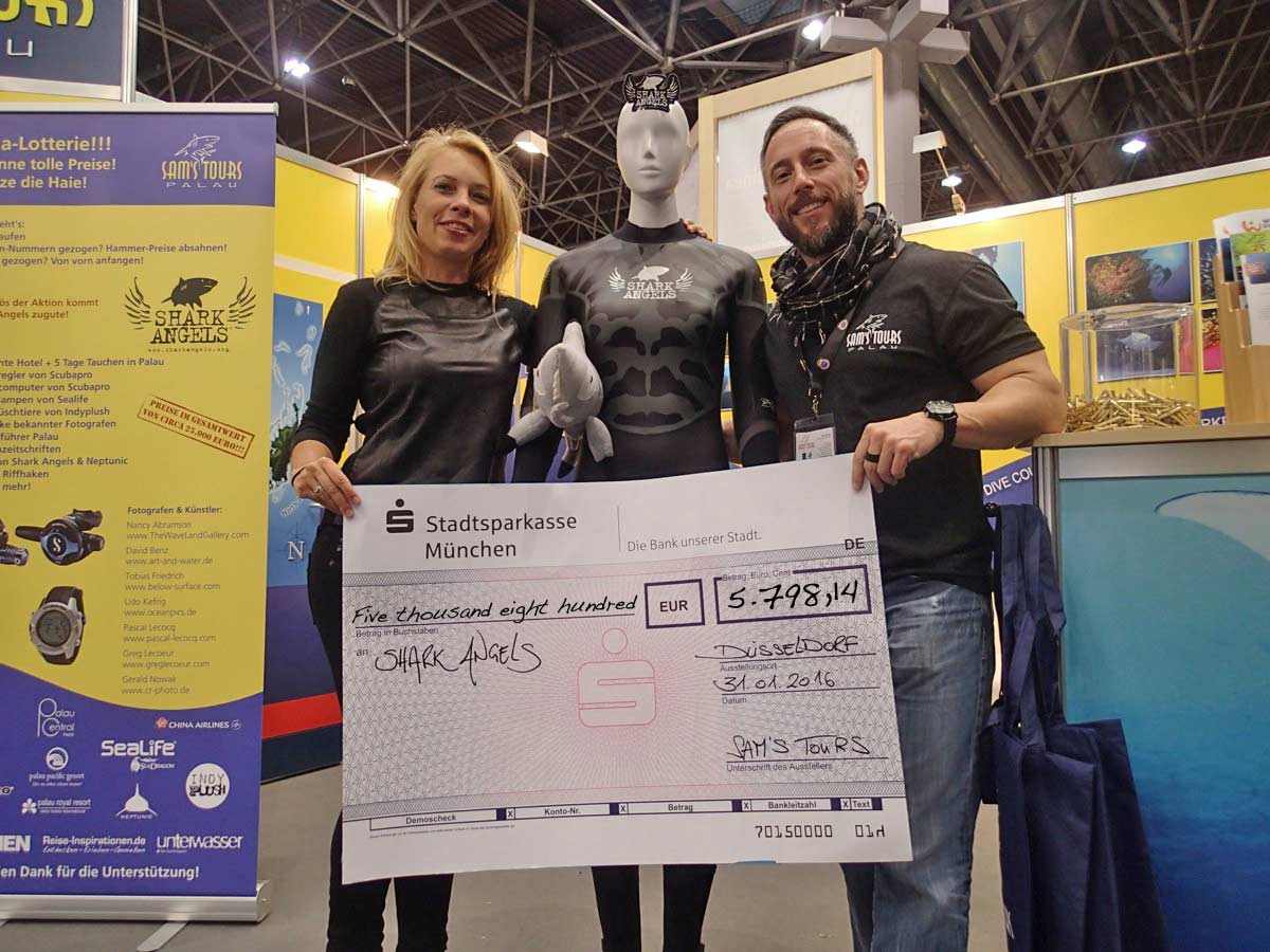 Sam's Tours boot lottery check handover